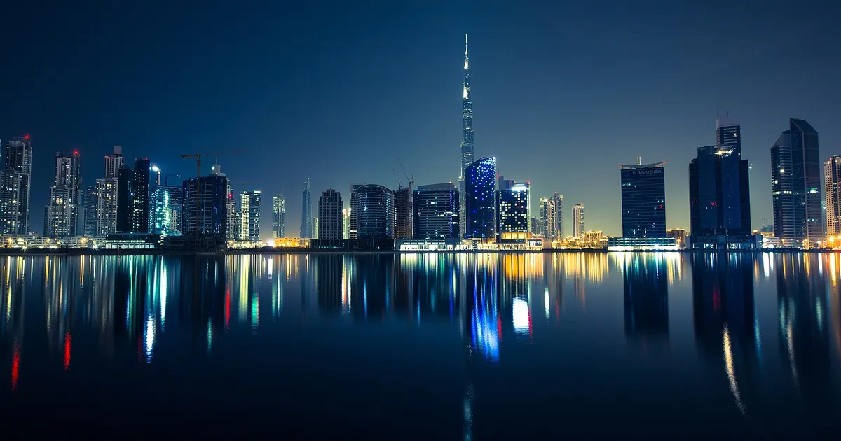 Dubai skyline with construction cranes over an off-plan development